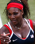 Serena Williams of the U.S. shakes hands with Denmark's Wozniacki after defeating her in their women's singles tennis quarterfinals match