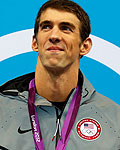 Michael Phelps of the U.S. smiles with his gold medal during the men's 200m individual medley victory ceremony during the London 2012 Olympic Games