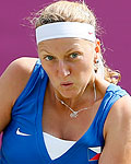 Czech Republic's Petra Kvitova returns to Italy's Pennetta in their women's singles tennis match at the All England Lawn Tennis Club during the London 2012 Olympic Games