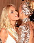 Models Anja Rubik of Poland and Karolina Kurkova of the Czech Republic greet each other as they arrive at the Metropolitan Museum of Art Costume Institute Benefit