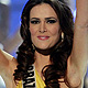 Miss Brazil Priscila Machado waves after the judges chose her as the second runner-up during the Miss Universe pageant in Sao Paulo