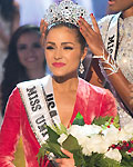 Miss USA Olivia reacts as she is crowned by Miss Universe 2011 Lopes during Miss Universe pageant in Las Vegas