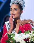 Miss USA Olivia reacts as she is crowned by Miss Universe 2011 Lopes during Miss Universe pageant in Las Vegas