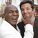 Mike Tyson jokes with cast member Bradley Cooper at the premiere of 'The Hangover Part II' at Grauman's Chinese theatre in Hollywood, California