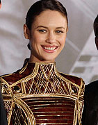 Director Joseph Kosinski, actress Olga Kurylenko and actor Tom Cruise pose for a photograph as they attend the premiere of their latest movie 'Oblivion' in Taipei