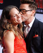 Cast member Robert Downey Jr. kisses his wife Susan at the premiere of 'Iron Man 3' at El Capitan theatre in Hollywood, California