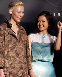 Cast members (L-R) Chris Evans, Tilda Swinton, Ko Ah-sung and Song Kang-ho pose for photographs during a news conference to promote their latest movie 'Snowpiercer' at a hotel in Seoul