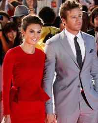 Cast member Armie Hammer (R) and his wife actress Elizabeth Chambers pose for photos during the Japan premiere of his movie 'The Lone Ranger' in Tokyo