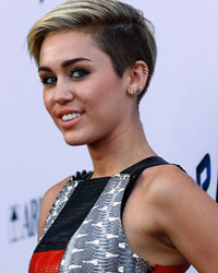 Singer Miley Cyrus poses at the premiere of 'Paranoia' in Los Angeles, California