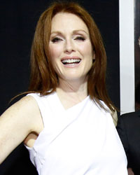 Director of the movie Kimberly Peirce (C) poses with cast members Julianne Moore (L) and Chloe Grace Moretz at the premiere of 'Carrie' in Los Angeles, California