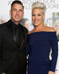 Cast member Alecia Moore, also known as Pink, and her husband Carey Hart pose at the premiere of 'Thanks for Sharing' in Los Angeles, California