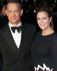 Actor Tom Hanks and his wife Rita Wilson arrive for the European premiere of 'Captain Phillips', on the opening night of the London Film Festival, at the Odeon Leicester Square, in central London