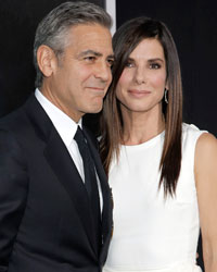 Actors George Clooney and Sandra Bullock arrive for the film premiere of 'Gravity' in New York