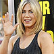 Cast member Jennifer Aniston waves at the premiere of Horrible Bosses at the Grauman's Chinese theatre in Hollywood