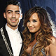 Singers Joe Jonas and Demi Lovato arrive at the 2011 MTV Video Music Awards in Los Angeles