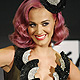 Katy Perry poses for photographers after winning Video of the Year for 'Firework', Best Collaboration, and Best Special Effects at the 2011 MTV Video Music Awards