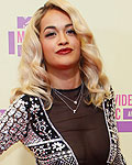 Singer Rita Ora poses as she arrives for the 2012 MTV Video Music Awards in Los Angeles