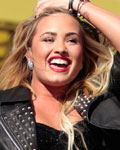 Singer Demi Lovato performs outside the Staples Center before the start of the 2012 MTV Video Music Awards in Los Angeles