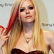 Avril Lavigne poses on the red carpet before the MTV Europe Awards ceremony in Munich