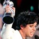 Green Day vocalist Billie Joe Armstrong (R) holds up his band's award for Video of the Year at the MTV Video Music Awards.