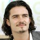 Orlando Bloom poses for photographers during arrivals for the MTV Video Music Awards in Miami.