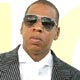 Jay Z gestures to photographers during arrivals for the MTV Video Music Awards in Miami.