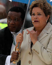 Brazilian President Dilma Rousseff (R) arrives at the First National Bank (FNB) Stadium, also known as Soccer City, ahead of the national memorial service for the late former South African President Nelson Mandela in Johannesburg