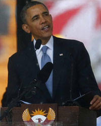 U.S. President Barack Obama delivers his speech at the memorial service for late South African President Nelson Mandela at the First National Bank soccer stadium, also known as Soccer City, in Johannesburg