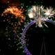 Fireworks explode over the London Eye in central London as part of New Year's celebrations