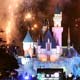 Thousands of visitors gather as '2006' is displayed on a screen when the clock strikes twelve at Hong Kong Disneyland.