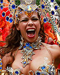 Performers dance at the Notting Hill Carnival in west London