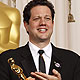 Michael Giacchino, winner for best achievement in music (original score) for the movie `Up,` poses with his Oscar backstage at the the 82nd Academy Awards