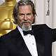 Bridges celebrates with his Oscar after winning best actor for his role in `Crazy Heart` at the the 82nd Academy Awards in Hollywood