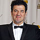 Ludovic Bource, winner of Best Original Score for 'The Artist', poses with his award backstage during the 84th Academy Awards in Hollywood