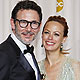 French director Hazanavicius and his wife Bejo hold his best director Oscar for the film 'The Artist' during the 84th Academy Awards