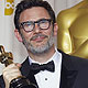 Director Michel Hazanavicius holds his Oscar after winning best picture for 'The Artist' backstage at the 84th Academy Awards in Hollywood