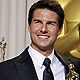 Tom Cruise poses for photographers with producer Thomas Langmann, whose film 'The Artist' won the best picture Oscar