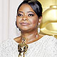 Octavia Spencer, best supporting actress winner for her role in 'The Help', poses with her award during the 84th Academy Awards in Hollywood