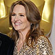 Presenter Melissa Leo poses next to Christopher Plummer, winner of the Actor in a Supporting Role award for his role in 'Beginners'