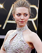 Actress Amanda Seyfried, from 'Les Miserables,' wearing an Alexander McQueen dress, arrives at the 85th Academy Awards in Hollywood, California