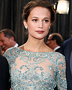 Director Nikolaj Arcel and actors Alicia Vikander and Mads Mikkelsen, of the best foreign language nominated Danish film 'A Royal Affair,' arrive at the 85th Academy Awards