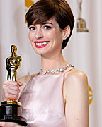 Anne Hathaway holds her Oscar for winning Best Supporting Actress for her role in 'Les Miserables' at the 85th Academy Awards in Hollywood, California