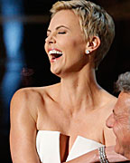 Charlize Theron and Dustin Hoffman present an award at the 85th Academy Awards in Hollywood, California