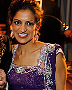 Canadian composer Mychael Danna holds his Oscar after winning the Best Original Score award for the film 'Life of Pi', next to his wife Aparna Danna at the Governors Ball following the 85th Academy Awards