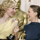 Actresses Cate Blanchett (L) and Hilary Swank share a laugh backstage at the 77th annual Academy Awards in Hollywood.