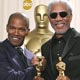 Actors Jamie Foxx (L) and Morgan Freeman shake hands after the 77th annual Academy Awards in Hollywood.