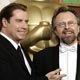 Composer Jan A.P. Kaczmarek (R) poses with his Oscar statue and actor/presenter John Travolta. Kaczmarek won the Academy Award for best original score for his work on the film 'Finding Neverland.'