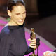 Actor Sean Penn (R) presents the Oscar for best actress to Hilary Swank at the 77th annual Academy Awards in Hollywood.