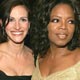 Julia Roberts and Oprah Winfrey pose together at the Governor's Ball after the 77th annual Academy Awards in Hollywood.