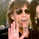 Mick Jagger arrives with L'Wren Scott at the Vanity Fair Oscar Party in West Hollywood